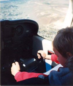 child flying an airplane